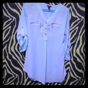 A very light blue flowy top